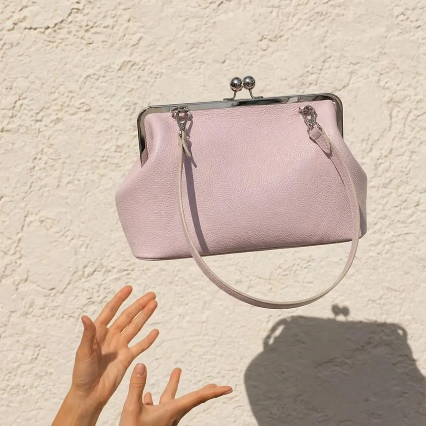 Blush Pastel Pebbled Kiss-Lock Frame Pouch With Silver Dual Ball Hardware, Slim Circular Shoulder Loop And Puffed Side Panel Silhouette