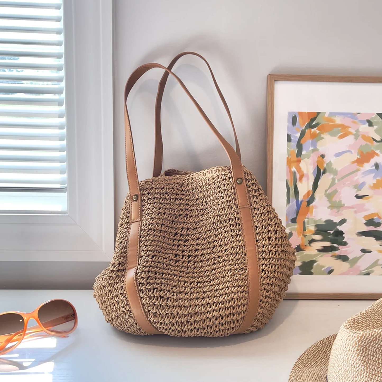 Natural Tan Hand-Woven Dumpling Shoulder Tote With Smooth Wide Carry Strips, Textile Inner Lining And Hidden Magnetic Snap Closure