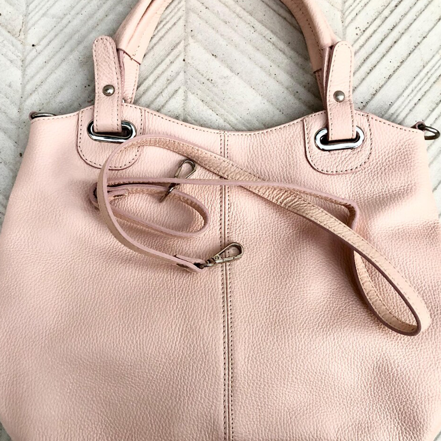 Pale Blush Pebbled Soft Shopper Tote With D-Ring Top Carry Tabs, Detachable Slim Hanging Strand And Dual Inner Zip Storage Slots
