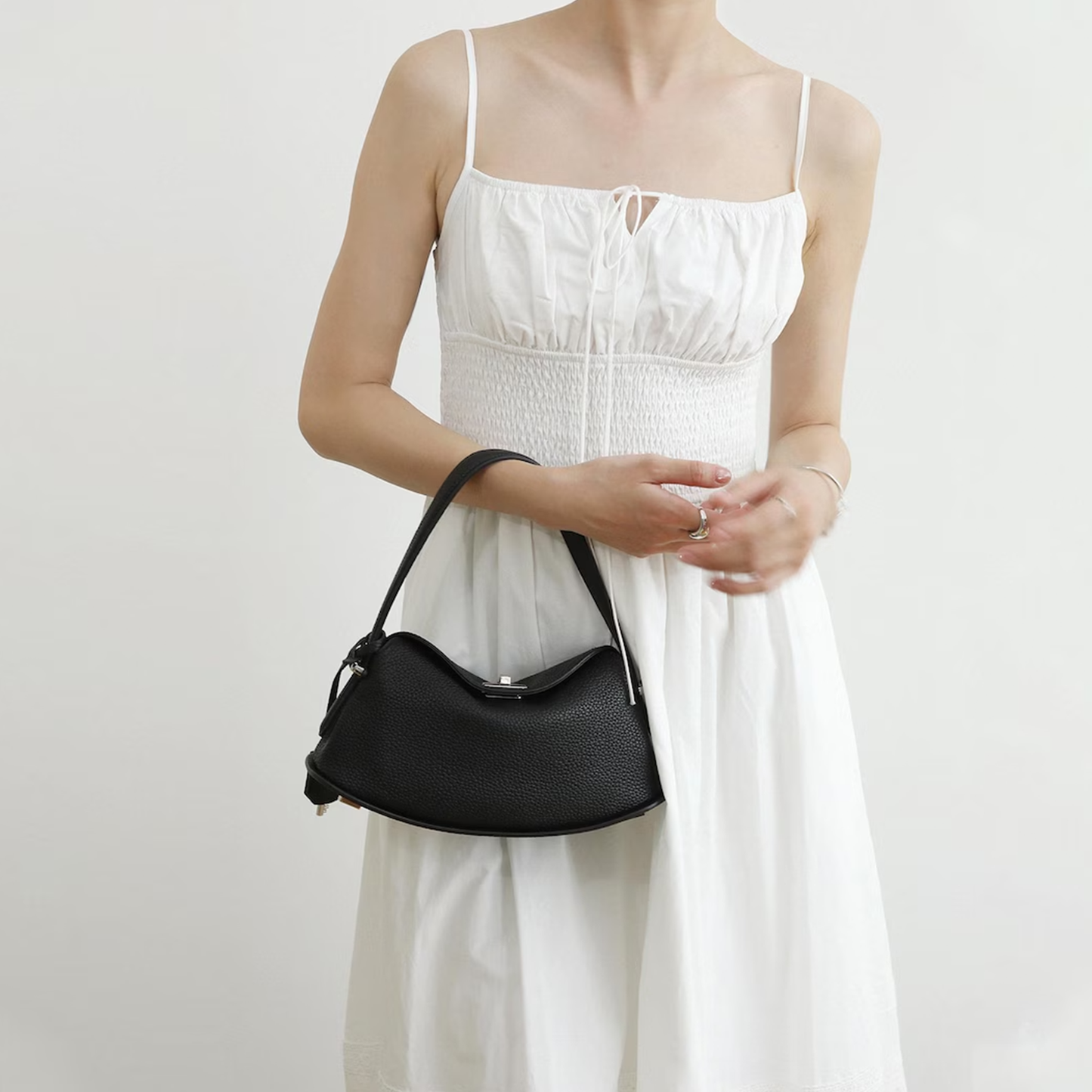 Triple-Tone Pebbled Curved Saddle Handbag With Arched Single Carry Loop, Metallic Turn-Lock Flap And Side Fabric Tab Detail